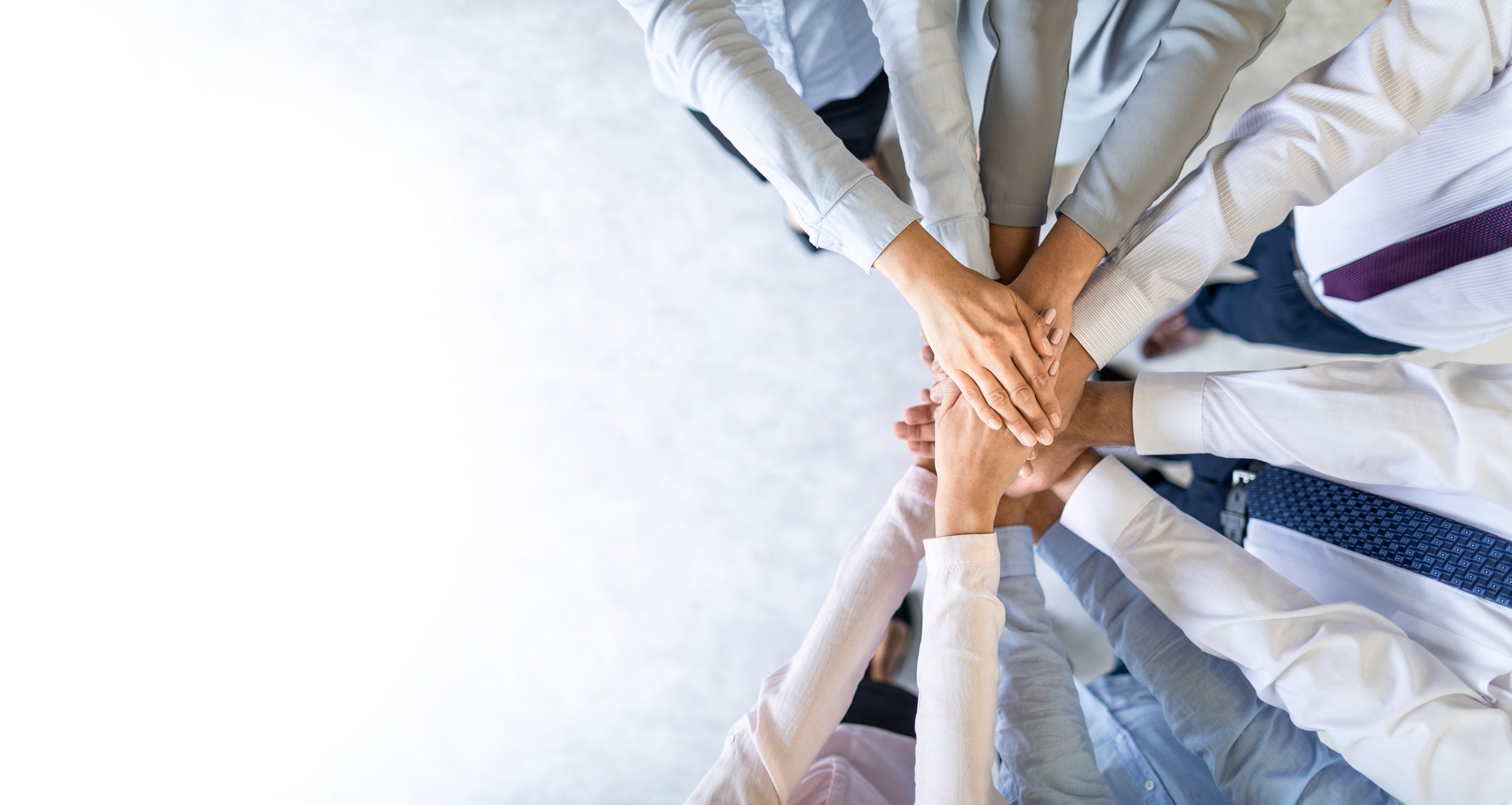 Businesspeople Joining Hands on White Background